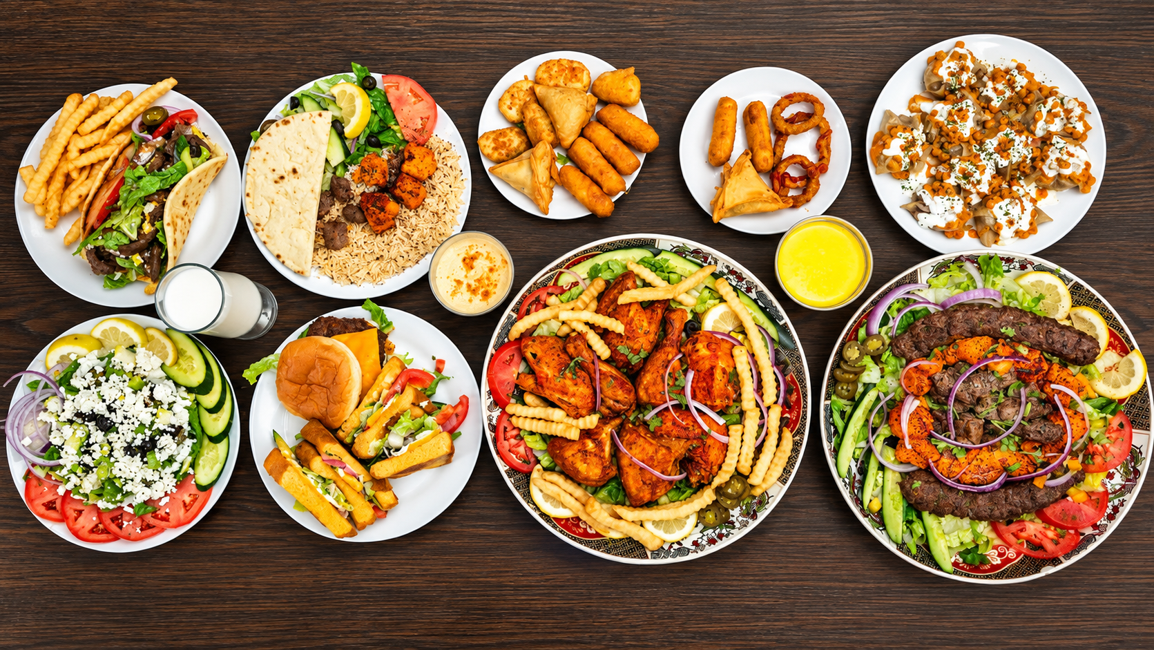 A generous spread of kebabs, gyro, rice, salad and appetizers at Red Chili